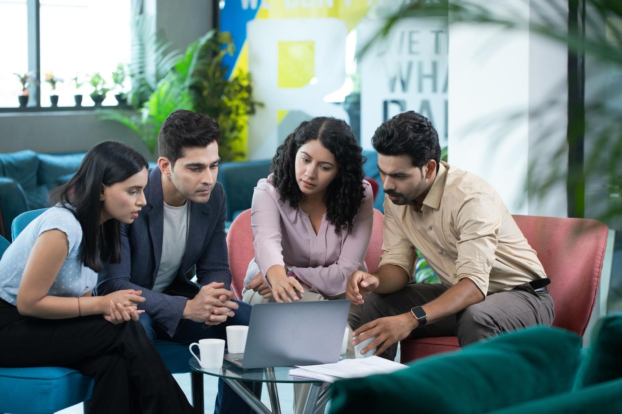 Team members at iMaker Technology collaborating and innovating together